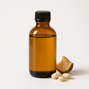 Cold-pressed baobab oil in amber bottle with baobab seeds, wholesale